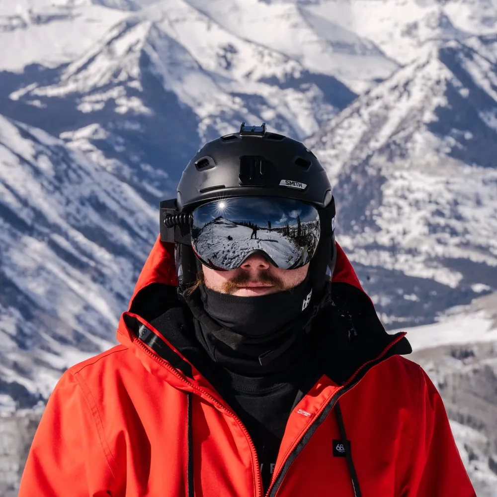 Alex in ski goggles on top of Crested Butte